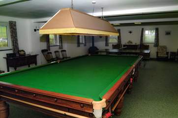 The full-size billiard table can provide hours of enjoyment.