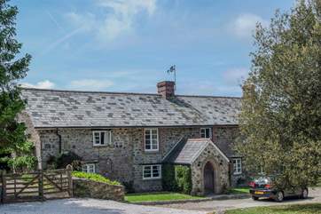 The front of the main house as you pull into the gravelled driveway.
