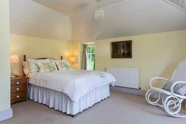 The master bedroom has a super-comfy bed, and is full of light.