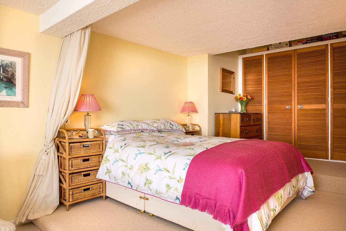 The bedroom-area is open to the rest of the apartment but can be curtained off if required.