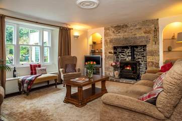 Enjoy looking over the garden with the roaring fire.