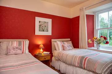 Twin beds overlook the garden in this bedroom (Bedroom 3).