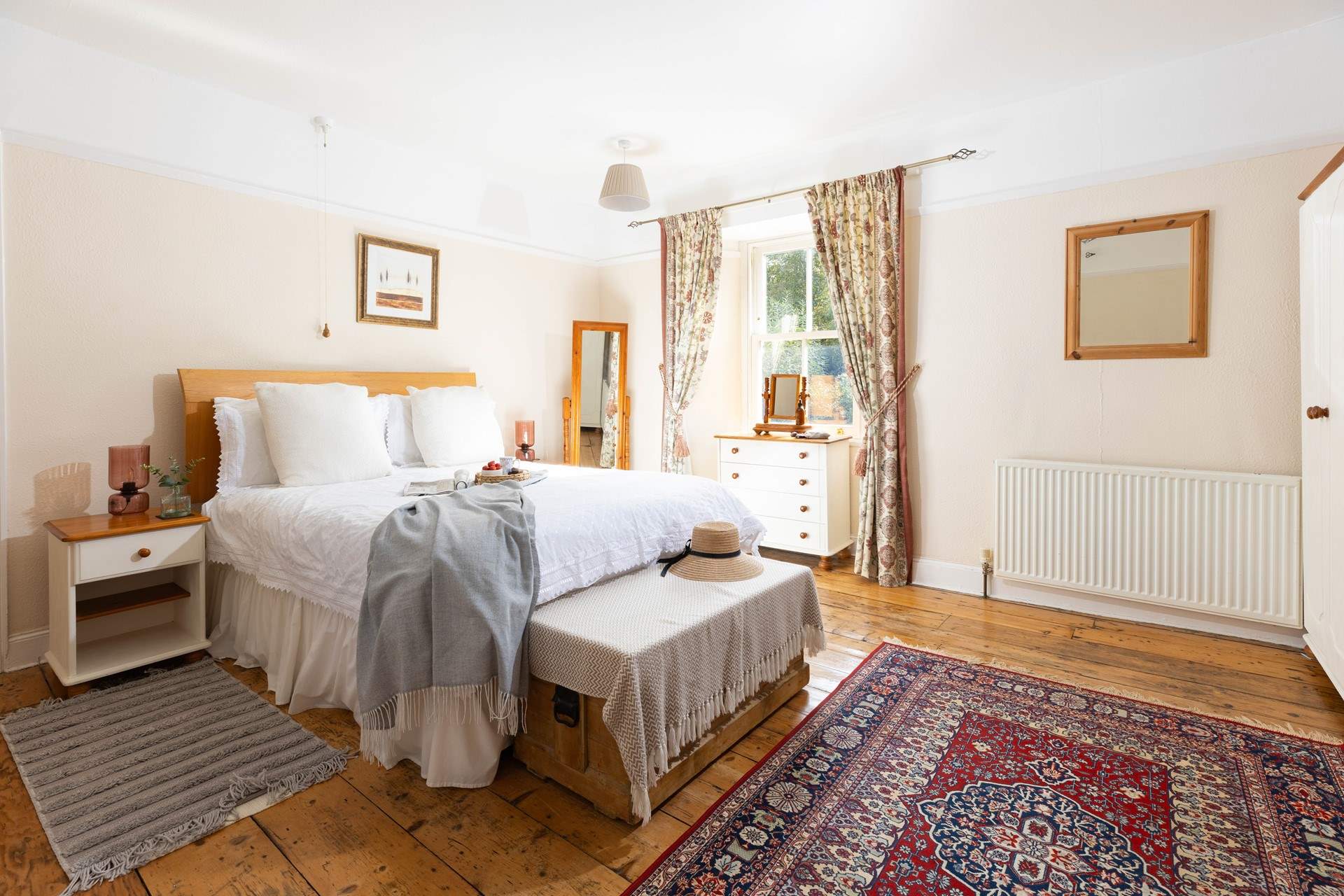 This large bedroom has a comfy double bed and views over the garden (Bedroom 1). 