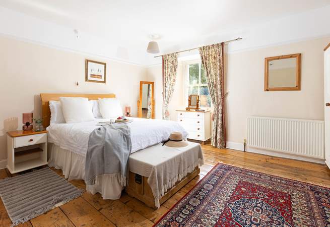 This large bedroom has a comfy double bed and views over the garden (Bedroom 1). 