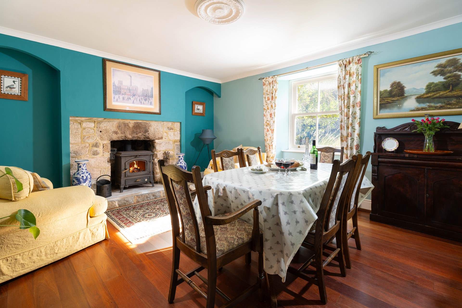 The cosy dining room is the perfect spot for long relaxing meals or snuggle up with a good book in front of the wood burner.