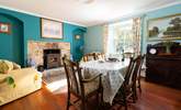 The cosy dining room is the perfect spot for long relaxing meals or snuggle up with a good book in front of the wood burner,  - Thumbnail Image