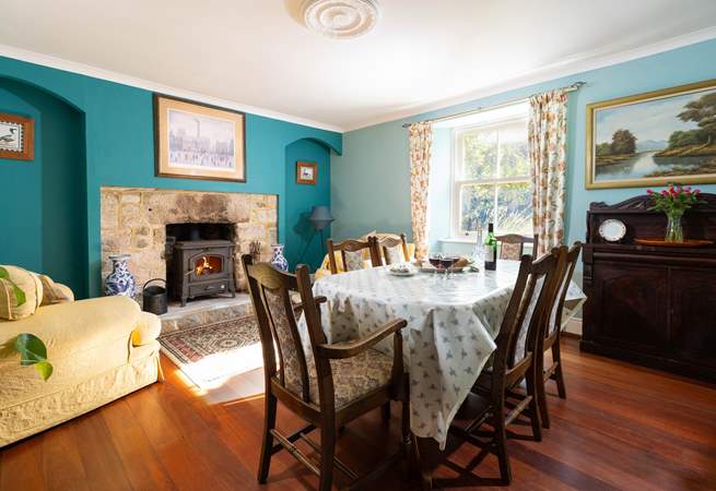 The cosy dining room is the perfect spot for long relaxing meals or snuggle up with a good book in front of the wood burner, 