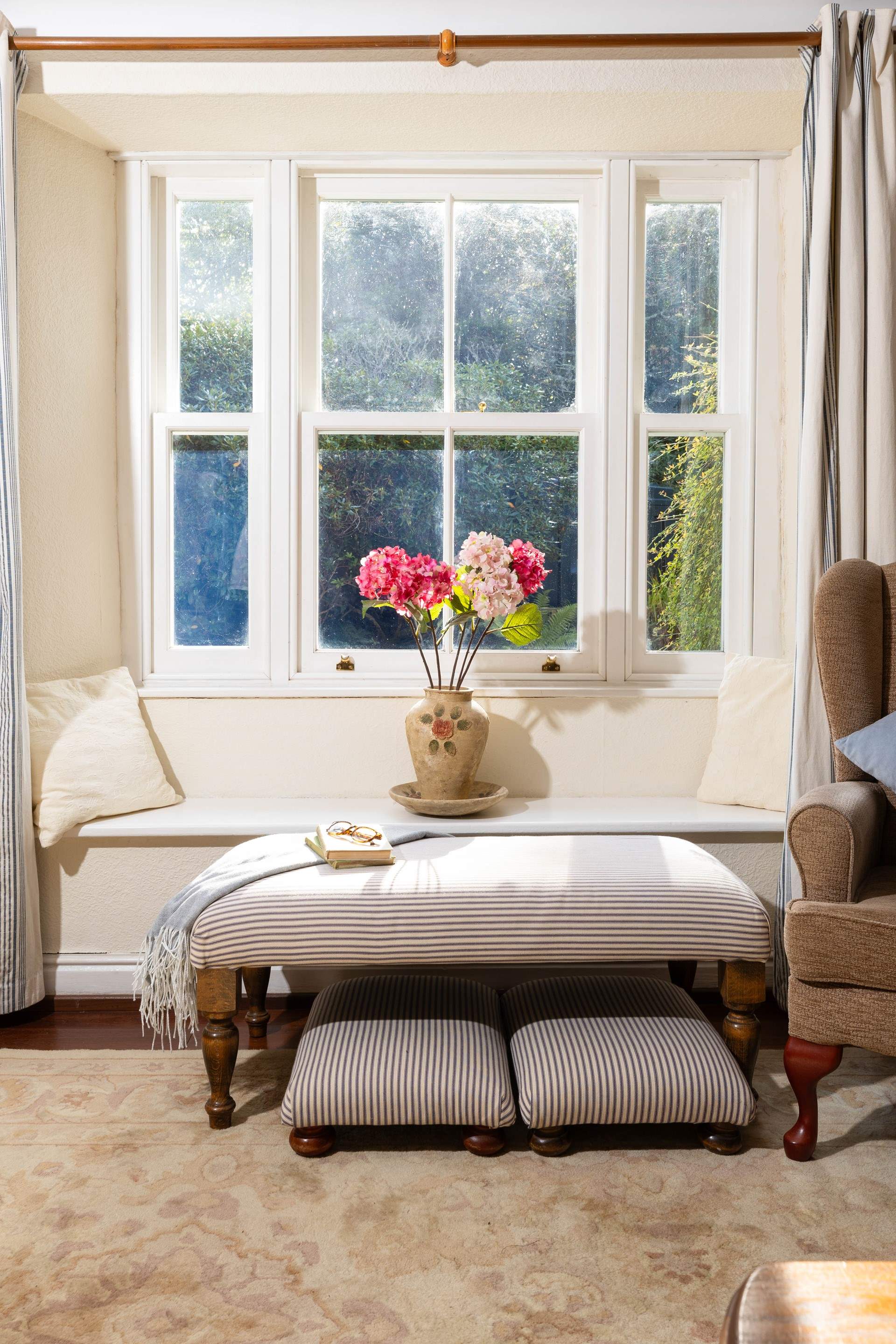 Large windows look out over the garden. 