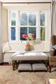 Large windows look out over the garden.