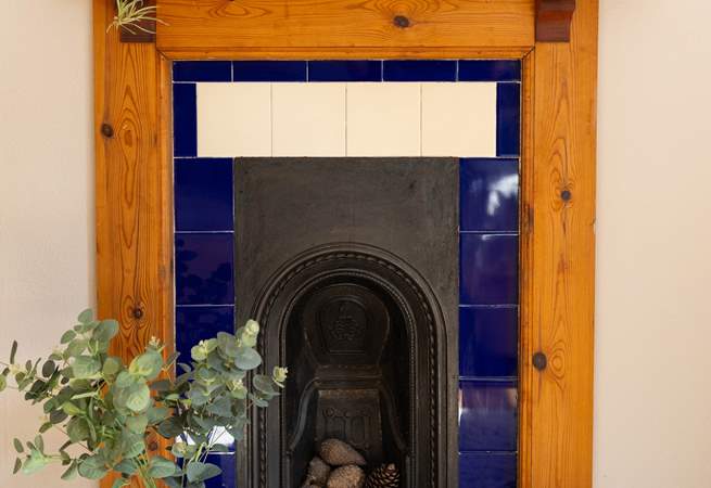 This bedroom also has a stunning ornamental fire place. 