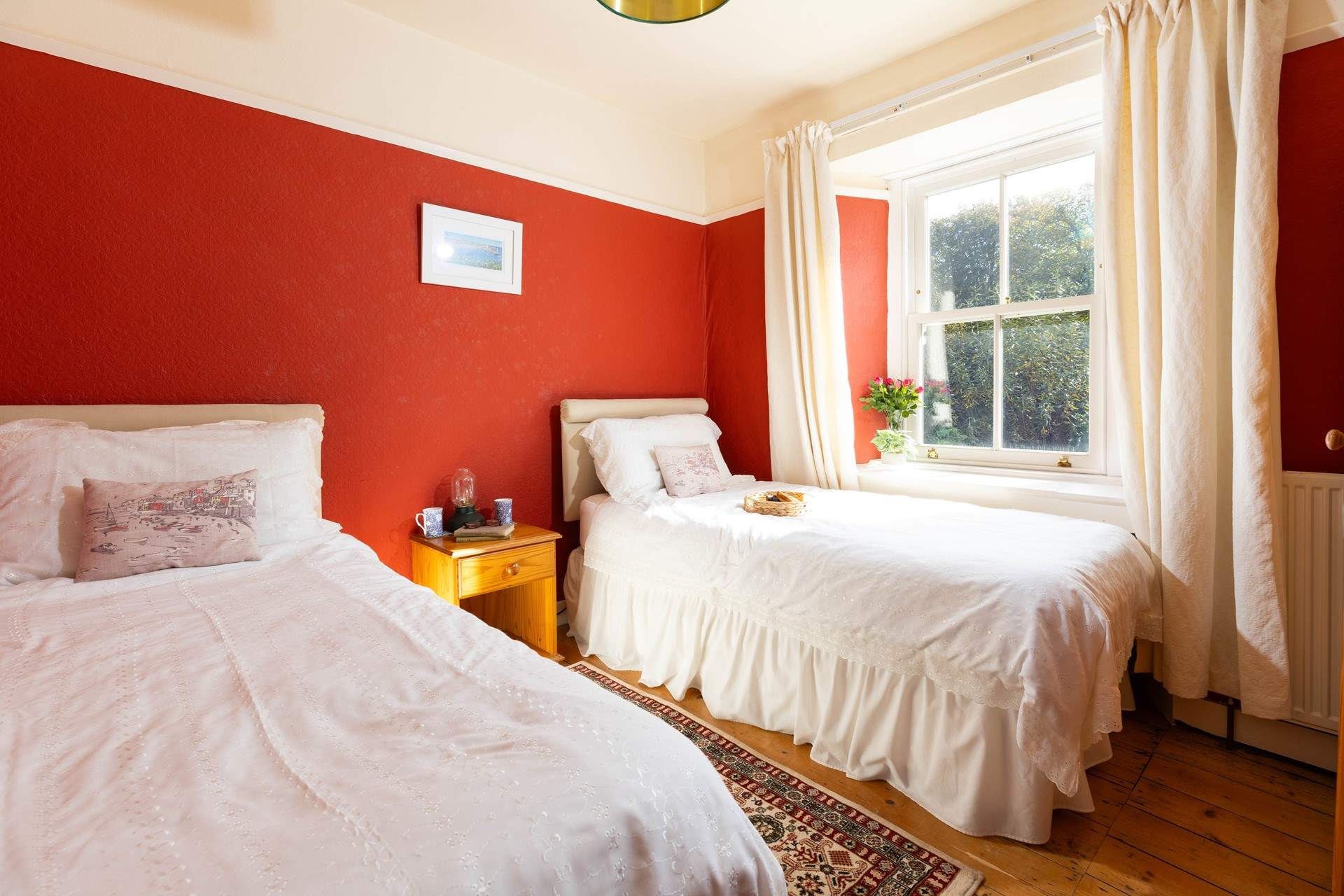 Bedroom 2 is decorated in warming tones for a  good nights slumber. 