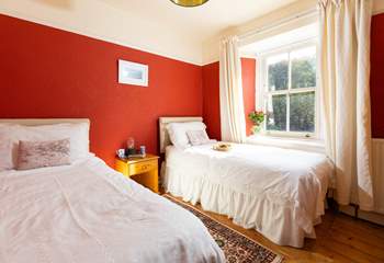 Bedroom 2 is decorated in warming tones for a  good nights slumber. 