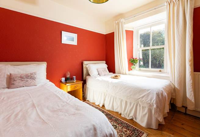 Bedroom 2 is decorated in warming tones for a  good nights slumber. 