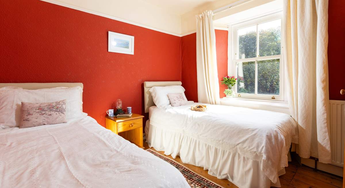 Bedroom 2 is decorated in warming tones for a  good nights slumber. 