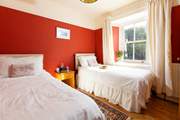 Bedroom 2 is decorated in warming tones for a  good nights slumber.