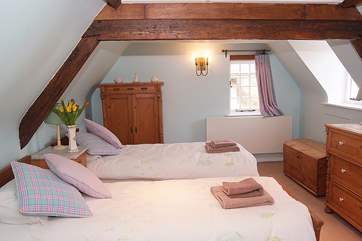 This is the twin bedroom up on the second floor. Children will love looking out at the steam train that runs past the side of the garden.