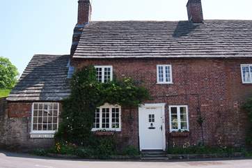The front of Brook Cottage, it is deceptively spacious inside and the National Trust castle is on top of the hill across the road!