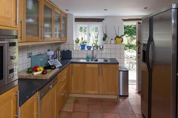 Equipped with almost everthing you could possibly want - a real home-from-home, a stable door leads out into the garden. The fridge/freezer has been replaced with a slightly smaller model.