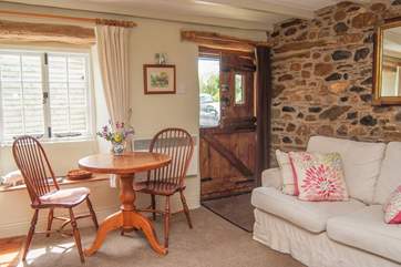 A stable-door opens into this lovely cottage, and a deep sofa to snuggle up in welcomes you on arrival.