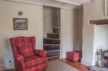 A lovely old armchair by the bottom of the steep stairs up to the bedroom.