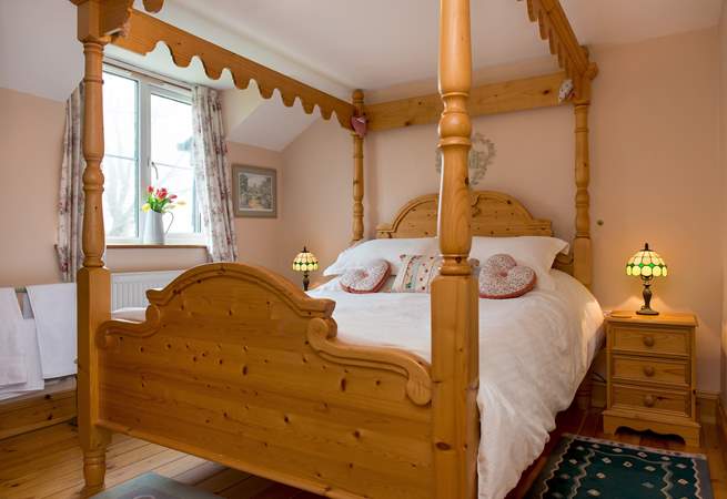 The gorgeous four-poster bed in bedroom 2.