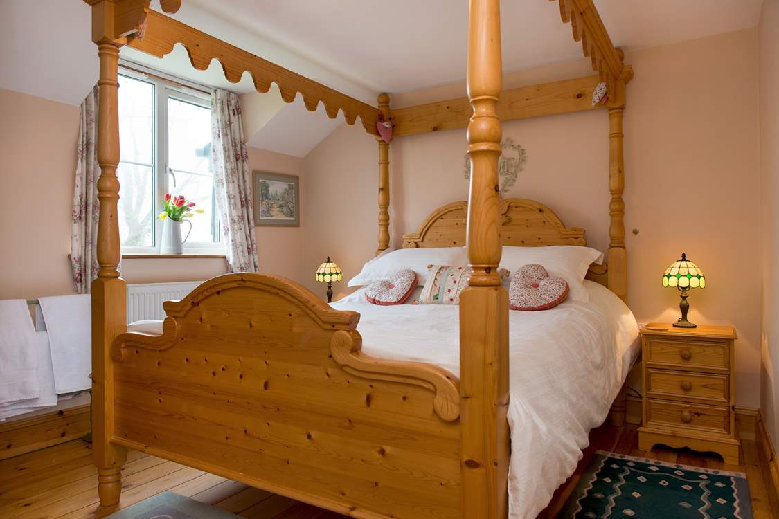 The gorgeous four-poster bed in bedroom 2.
