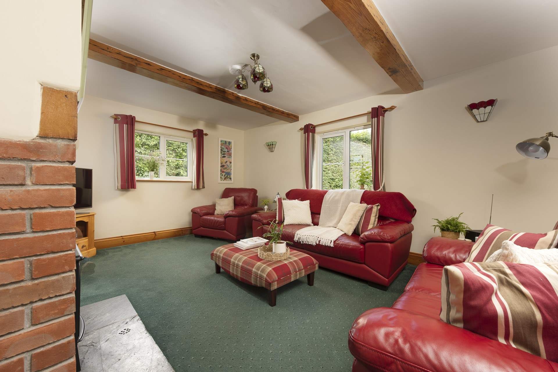 Plenty of room for all to relax in the cottage sitting-room.