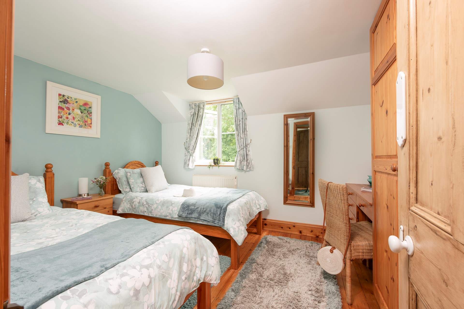 Twin beds await in bedroom 3.