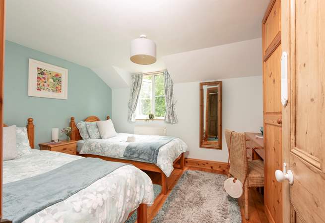 Twin beds await in bedroom 3.