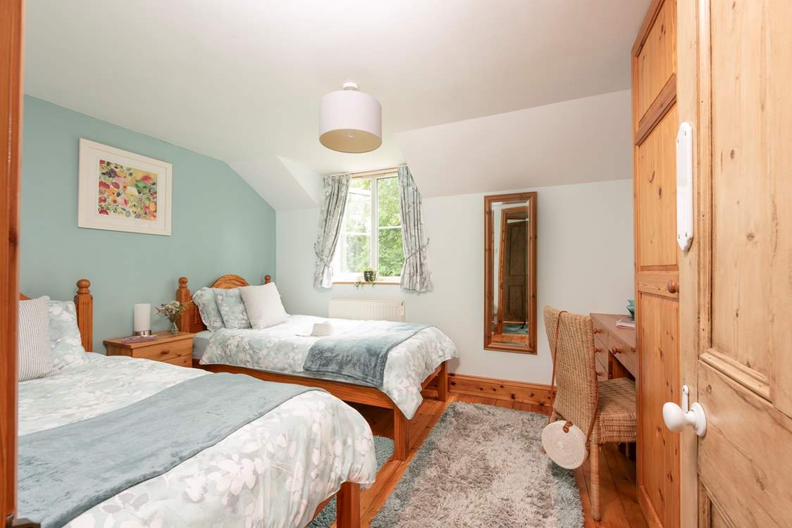Twin beds await in bedroom 3.