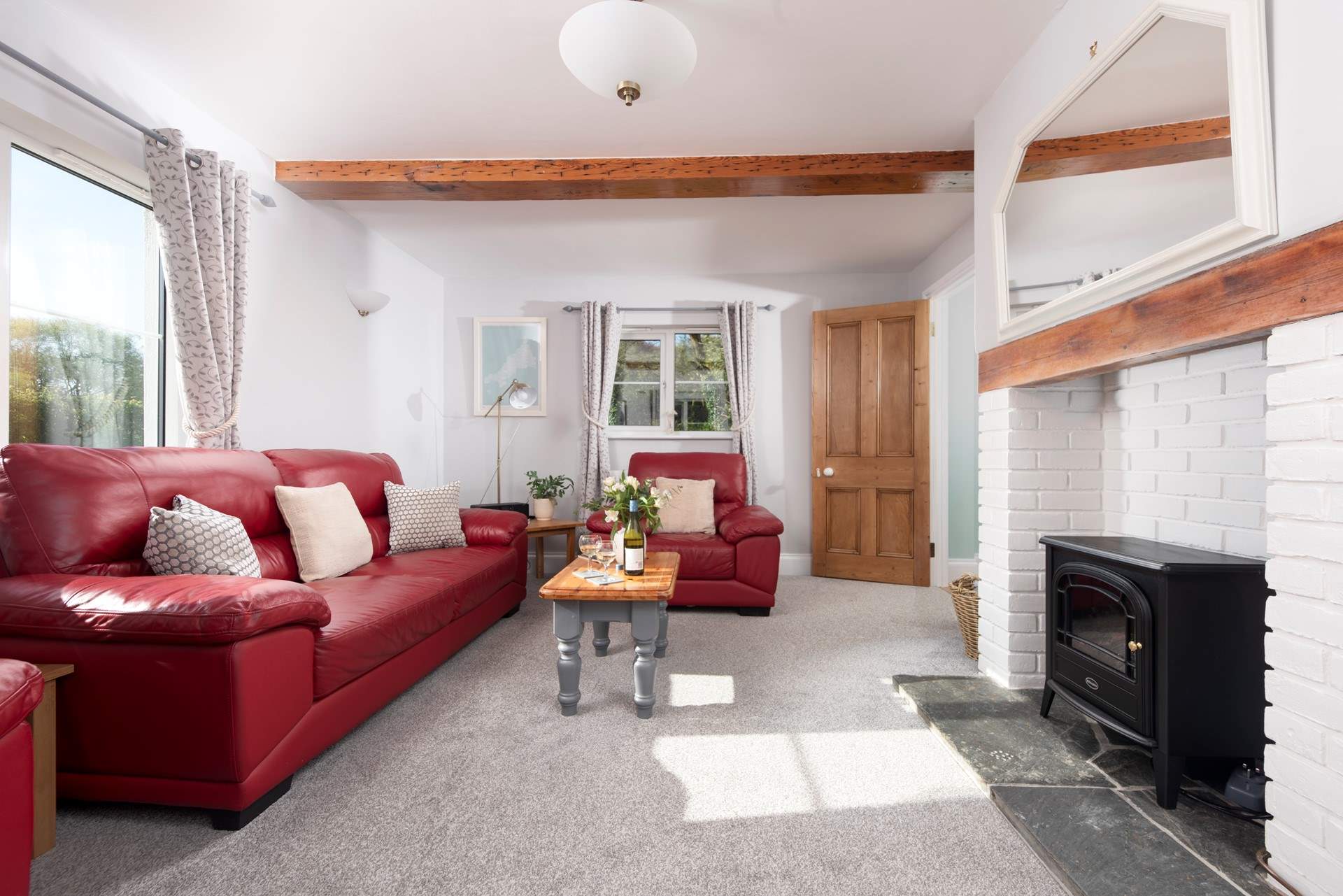 The wood-burner effect electric stove makes the sitting-room warm and cosy all year round