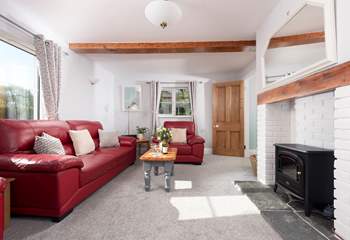 The wood-burner effect electric stove makes the sitting-room warm and cosy all year round