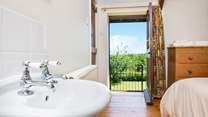The door from the double bedroom leads out to a set of stairs which take you down to the garden.