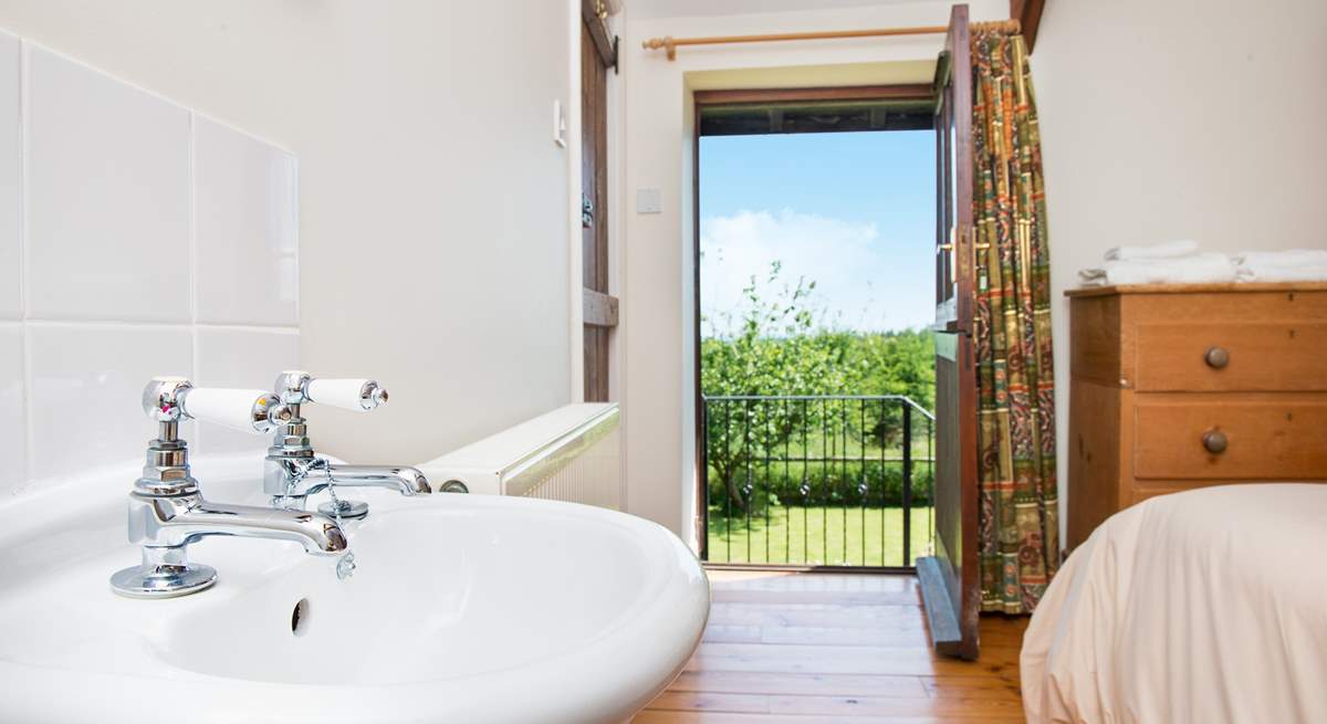 The door from the double bedroom leads out to a set of stairs which take you down to the garden.