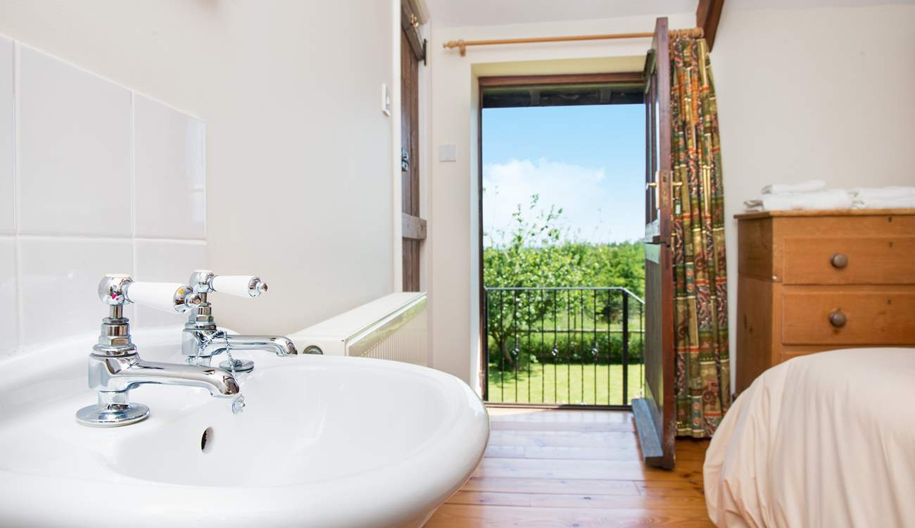 The door from the double bedroom leads out to a set of stairs which take you down to the garden.