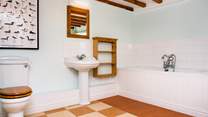 The main bathroom is very spacious. There is also a shower-room on the first floor.