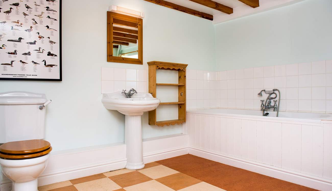 The main bathroom is very spacious. There is also a shower-room on the first floor.