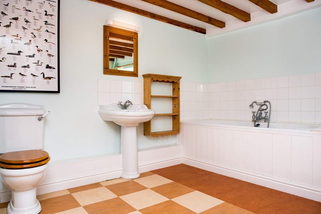 The main bathroom is very spacious. There is also a shower-room on the first floor.