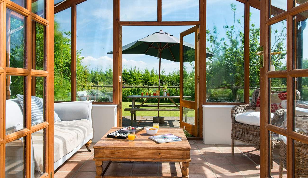 Double doors lead off from the living-room to the conservatory.