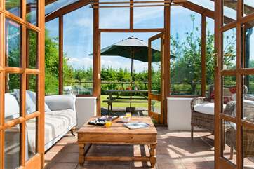 Double doors lead off from the living-room to the conservatory.