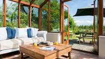 The conservatory provides the ideal place to sit back and enjoy the wonderful setting.