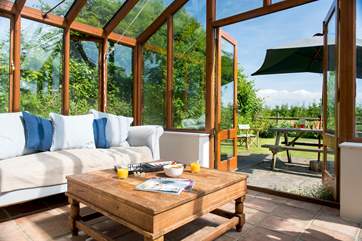 The conservatory provides the ideal place to sit back and enjoy the wonderful setting.