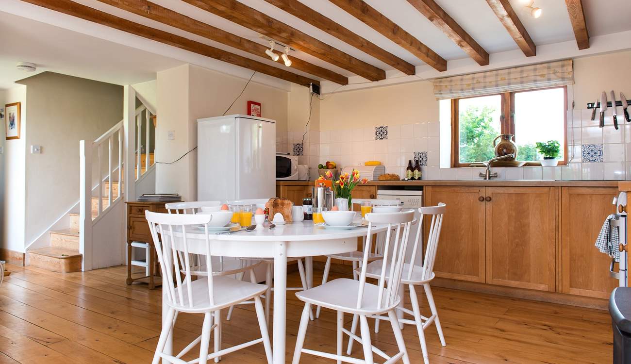 The hall and stairs lead off from the kitchen end of the living area.