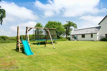 Next to the house is a large communal play-area