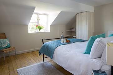 Bedroom 2, the en suite double bedroom. This bedroom has amazing views right out across the valley to the front of the cottage.