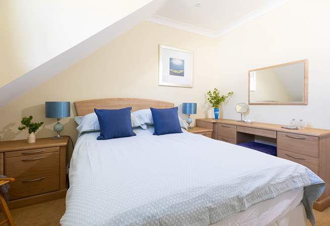 A comfy double bed awaits in bedroom 1.