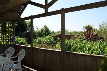 The deck faces across the driveway towards the children's play-area.