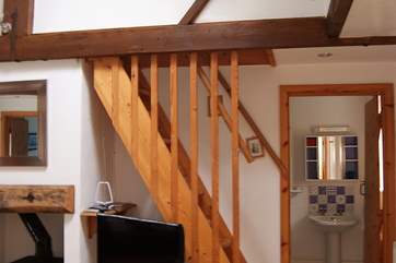 The first floor twin bedroom (Bedroom 3) is accessed by steep ladder-style stairs from the living-room.