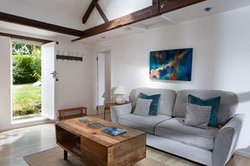 A door from the living-room opens out to the enclosed garden beside the cottage.