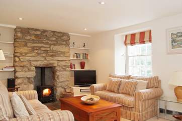 The beautifully furnished sitting-room is extremely comfortable and welcoming.